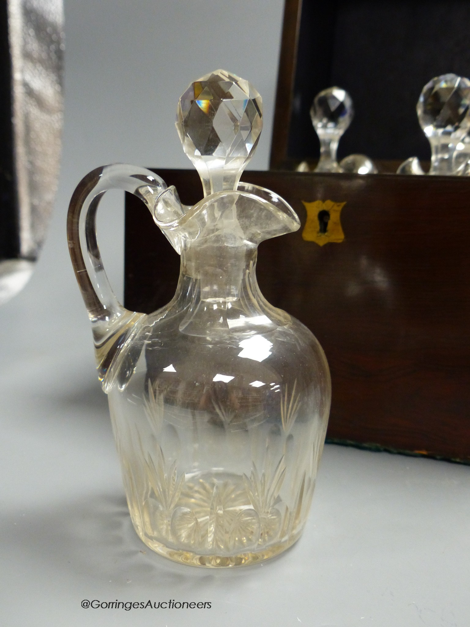 A Victorian rosewood case set of cut glass liqueur decanters, case is 22cm high, width 20cm, depth 20cm